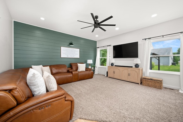203 Stearn Dr, Genoa, IL 60135 - carpeted living room with a ceiling fan, recessed lighting, and wood walls