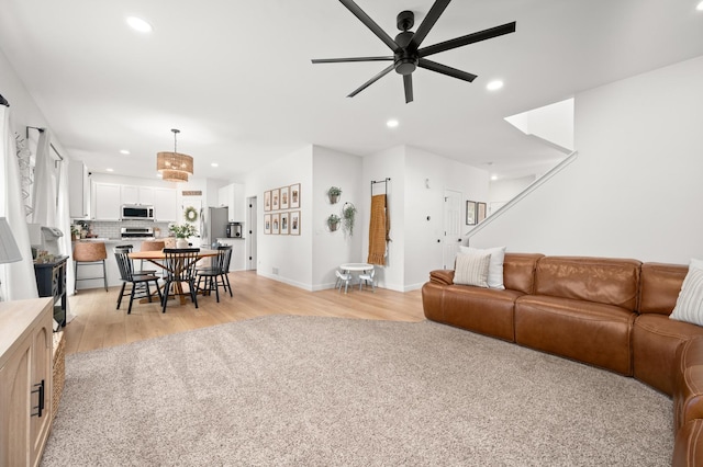203 Stearn Dr, Genoa, IL 60135 - living room with a ceiling fan, light wood-style flooring, and recessed lighting
