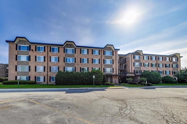 1227 S Old Wilke Rd Unit 304, Arlington Heights, IL 60005 - view of apartment building / complex featuring uncovered parking