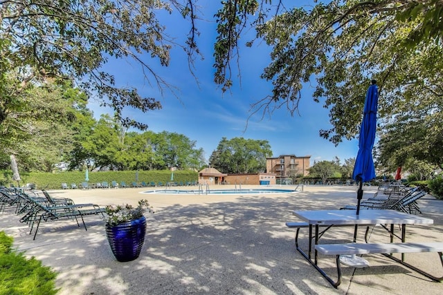 1227 S Old Wilke Rd Unit 304, Arlington Heights, IL 60005 - view of community featuring a pool and a patio