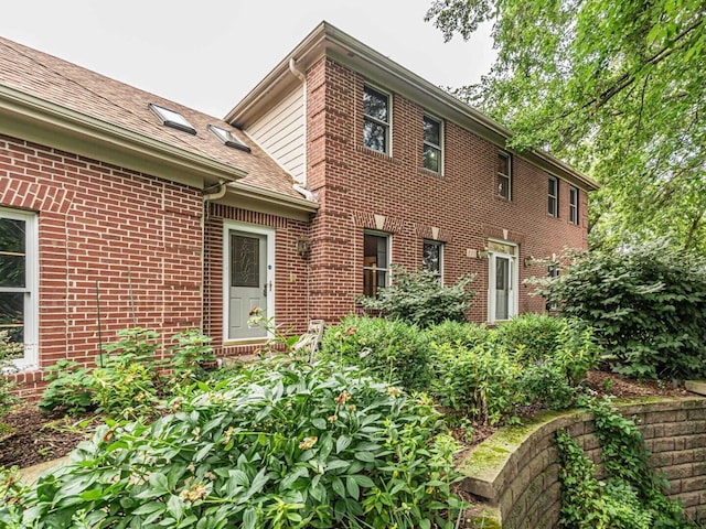 231 Deer Ln, Sleepy Hollow, IL 60118 - rear view of house with brick siding and a shingled roof