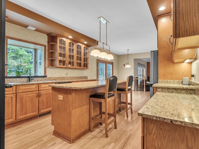 231 Deer Ln, Sleepy Hollow, IL 60118 - kitchen with light wood-style flooring, plenty of natural light, a kitchen breakfast bar, and recessed lighting