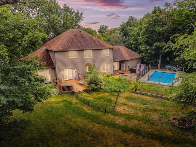 231 Deer Ln, Sleepy Hollow, IL 60118 - back of property at dusk featuring a deck