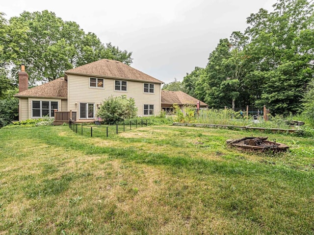 231 Deer Ln, Sleepy Hollow, IL 60118 - back of property featuring a fire pit and a chimney