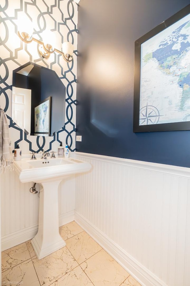 2418 N Southport Ave Unit 1, Chicago, IL 60614 - bathroom with a wainscoted wall and marble finish floors