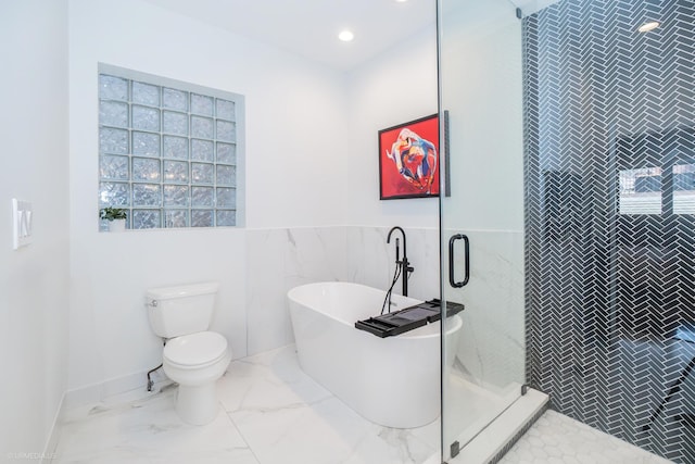 2418 N Southport Ave Unit 1, Chicago, IL 60614 - full bathroom featuring tile walls, a freestanding bath, a shower stall, marble finish floors, and recessed lighting