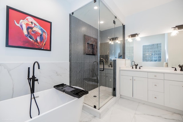 2418 N Southport Ave Unit 1, Chicago, IL 60614 - bathroom with a soaking tub, a stall shower, double vanity, marble look tile flooring, and recessed lighting