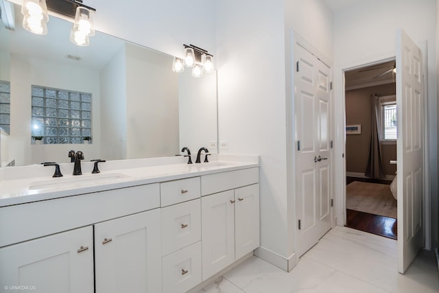 2418 N Southport Ave Unit 1, Chicago, IL 60614 - full bathroom with double vanity and marble finish floors