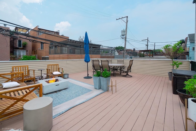 2418 N Southport Ave Unit 1, Chicago, IL 60614 - deck with an outdoor fire pit and outdoor dining space