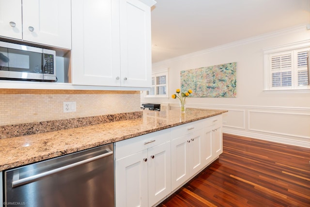 2418 N Southport Ave Unit 1, Chicago, IL 60614 - kitchen featuring stainless steel appliances, ornamental molding, white cabinetry, decorative backsplash, and dark wood finished floors
