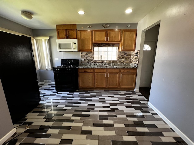 103 Morris St, Bellwood, IL 60104 - kitchen featuring black appliances, backsplash, brown cabinetry, and recessed lighting