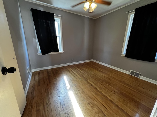 103 Morris St, Bellwood, IL 60104 - unfurnished room with hardwood / wood-style floors, crown molding, and a ceiling fan