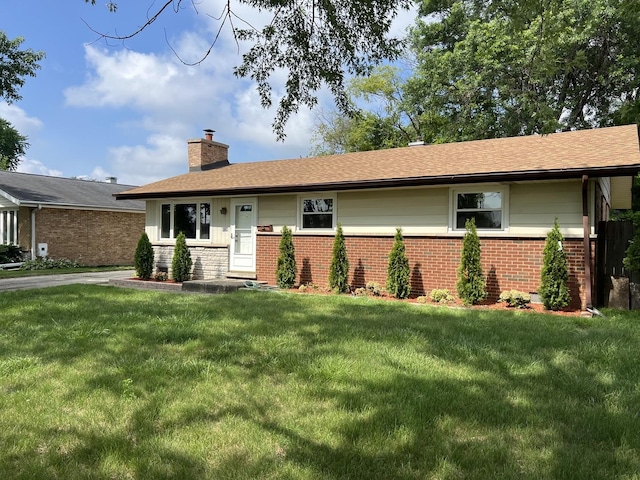 9128 Homestead Ln, Bridgeview, IL 60455 - ranch-style home featuring a chimney, a front yard, brick siding, and a shingled roof