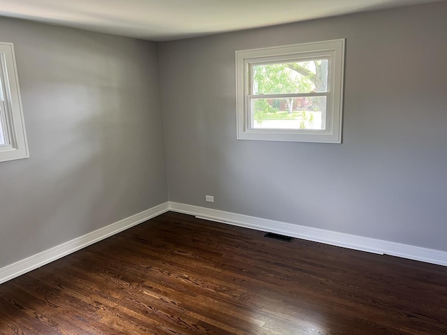 9128 Homestead Ln, Bridgeview, IL 60455 - unfurnished room featuring baseboards and dark wood-style floors