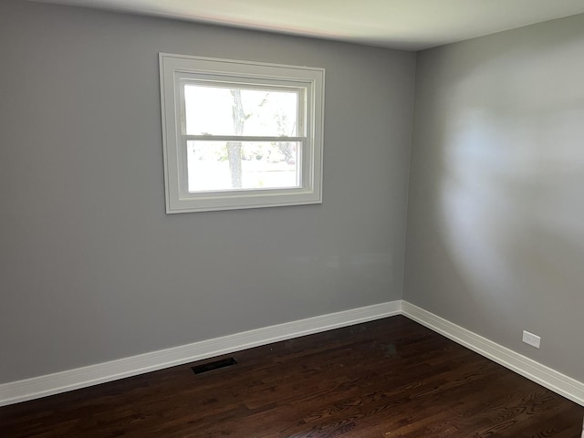 9128 Homestead Ln, Bridgeview, IL 60455 - empty room featuring baseboards and dark wood-style flooring