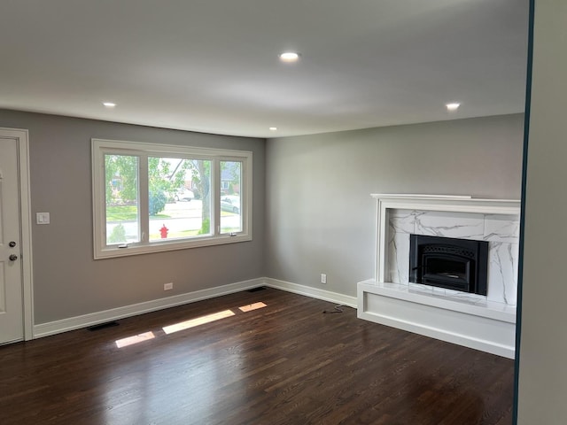 9128 Homestead Ln, Bridgeview, IL 60455 - unfurnished living room featuring dark wood-type flooring, recessed lighting, and a fireplace