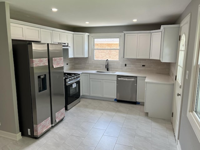 9128 Homestead Ln, Bridgeview, IL 60455 - kitchen with stainless steel appliances, backsplash, light countertops, extractor fan, and recessed lighting