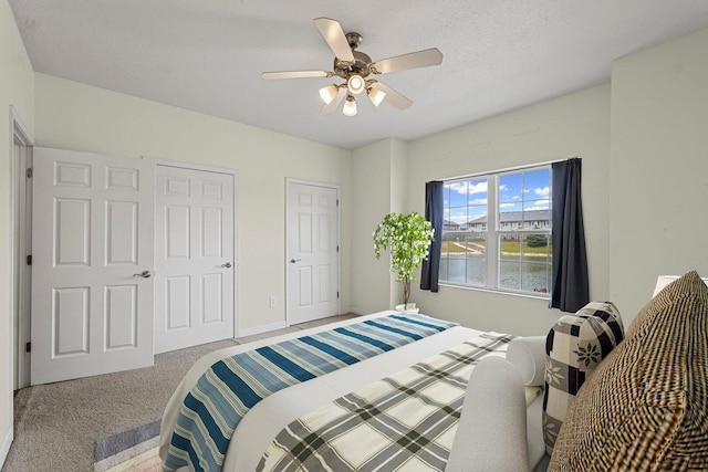 3718 Thornhill Dr Unit 0, Champaign, IL 61822 - carpeted bedroom featuring a ceiling fan and baseboards