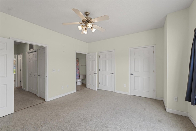 3718 Thornhill Dr Unit 0, Champaign, IL 61822 - unfurnished bedroom with carpet floors, ensuite bath, and ceiling fan