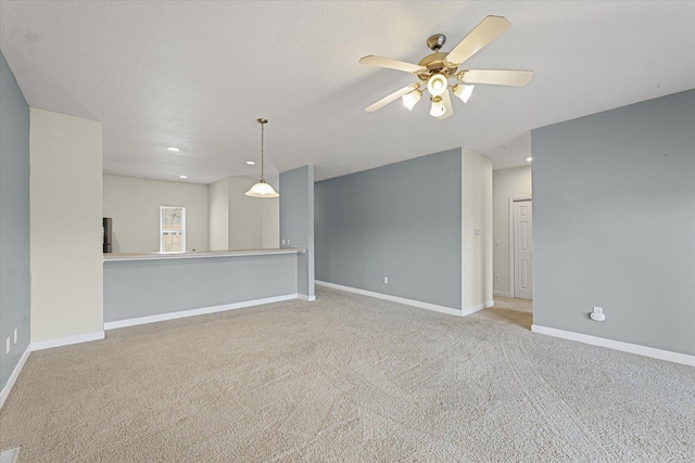 3718 Thornhill Dr Unit 0, Champaign, IL 61822 - unfurnished living room featuring carpet, a ceiling fan, and recessed lighting