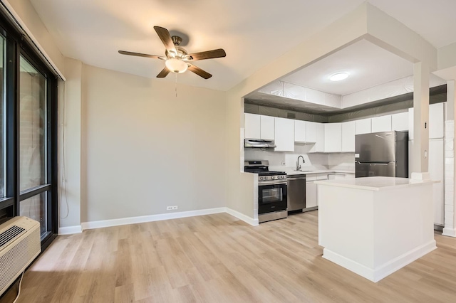 3041 S Michigan Ave Unit 501, Chicago, IL 60616 - kitchen with appliances with stainless steel finishes, light wood-style flooring, extractor fan, light countertops, and ceiling fan