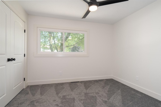 1717 Liston Ct, Normal, IL 61761 - unfurnished bedroom featuring dark colored carpet and a ceiling fan