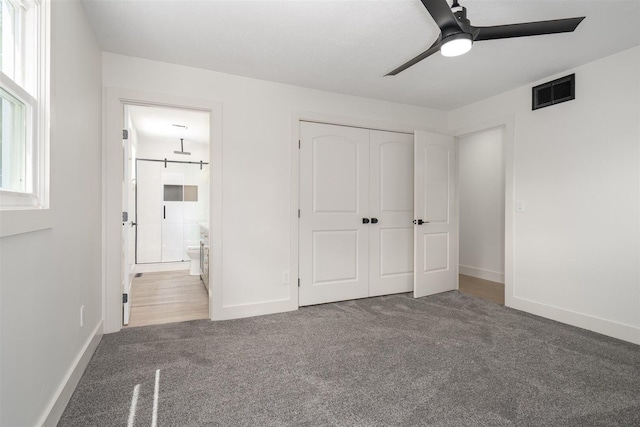1717 Liston Ct, Normal, IL 61761 - unfurnished bedroom with carpet flooring, a closet, ensuite bathroom, and ceiling fan