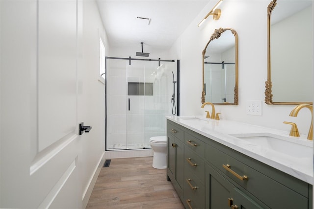 1717 Liston Ct, Normal, IL 61761 - full bathroom with double vanity, a stall shower, and wood finished floors