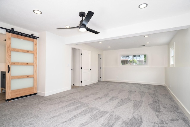 1717 Liston Ct, Normal, IL 61761 - empty room featuring recessed lighting, a barn door, carpet flooring, and ceiling fan