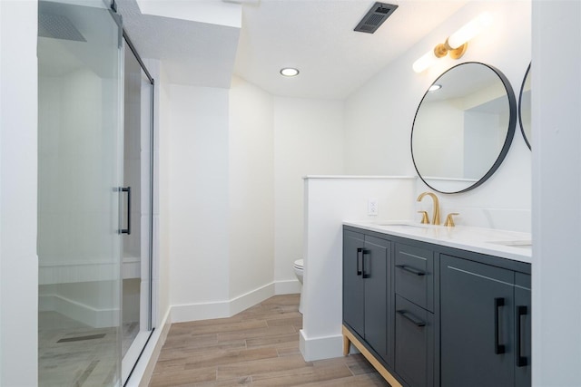 1717 Liston Ct, Normal, IL 61761 - full bathroom with a shower stall, double vanity, wood finished floors, and recessed lighting