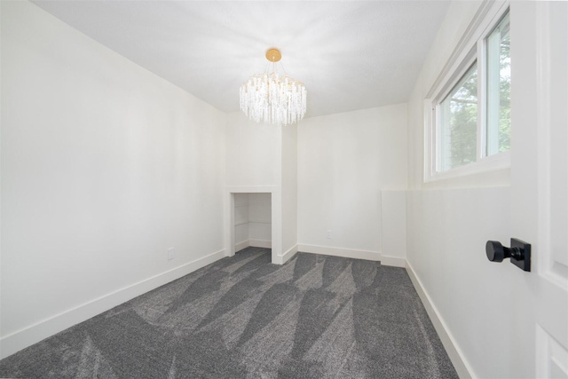 1717 Liston Ct, Normal, IL 61761 - unfurnished room featuring a chandelier and dark carpet