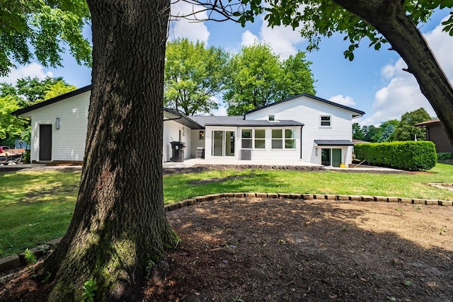 1717 Liston Ct, Normal, IL 61761 - back of house featuring a lawn and a patio area