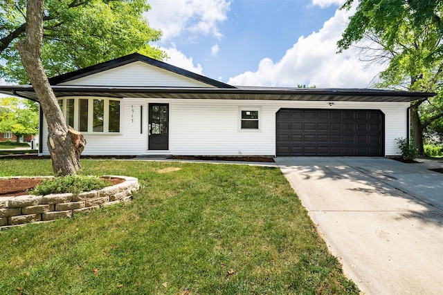 1717 Liston Ct, Normal, IL 61761 - view of front of property featuring a garage, a front yard, and concrete driveway
