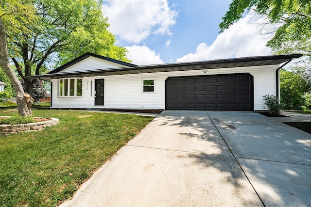 1717 Liston Ct, Normal, IL 61761 - ranch-style house featuring a front yard, concrete driveway, and an attached garage