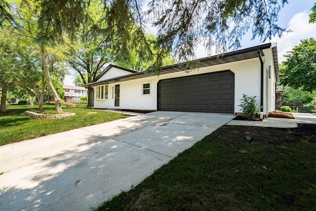 1717 Liston Ct, Normal, IL 61761 - ranch-style house featuring driveway, a front lawn, and an attached garage