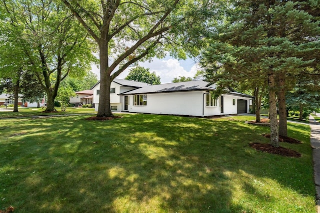 1717 Liston Ct, Normal, IL 61761 - view of green lawn featuring a garage