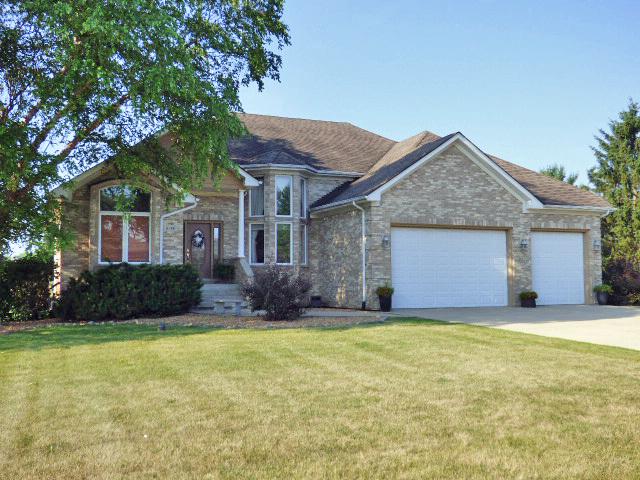 41W951 Hunters Hill Dr, Saint Charles, IL 60175 - view of front of property with an attached garage, driveway, and a front lawn