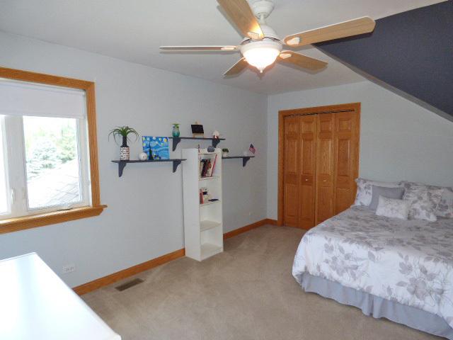 41W951 Hunters Hill Dr, Saint Charles, IL 60175 - bedroom with light carpet, a closet, and a ceiling fan