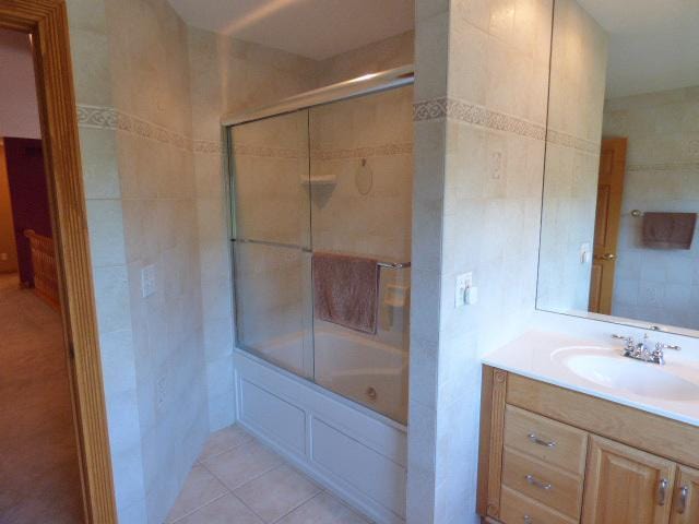 41W951 Hunters Hill Dr, Saint Charles, IL 60175 - bathroom featuring tile walls, vanity, shower / bath combination with glass door, and tile patterned floors