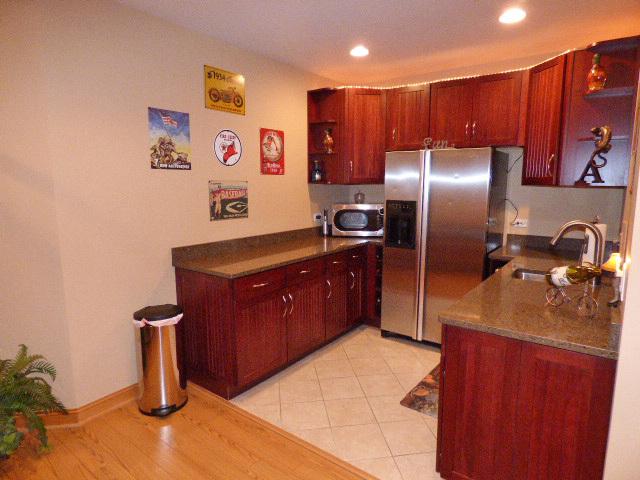 41W951 Hunters Hill Dr, Saint Charles, IL 60175 - kitchen featuring stainless steel appliances, open shelves, recessed lighting, dark countertops, and dark brown cabinets