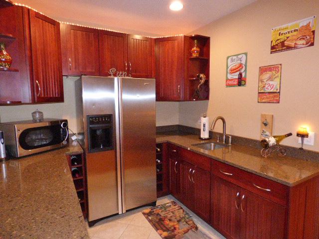 41W951 Hunters Hill Dr, Saint Charles, IL 60175 - kitchen with stainless steel appliances, open shelves, and dark stone counters