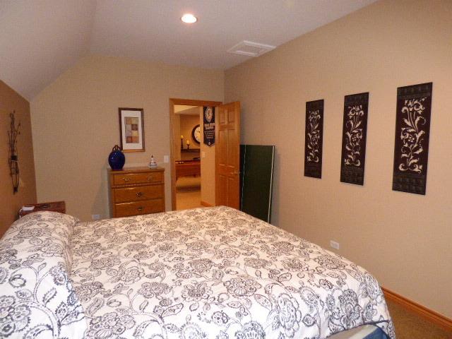 41W951 Hunters Hill Dr, Saint Charles, IL 60175 - carpeted bedroom featuring lofted ceiling and recessed lighting