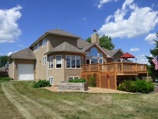 41W951 Hunters Hill Dr, Saint Charles, IL 60175 - rear view of property featuring a chimney, a lawn, a deck, and a garage
