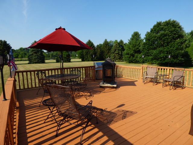 41W951 Hunters Hill Dr, Saint Charles, IL 60175 - wooden terrace featuring outdoor dining area, a lawn, and a grill