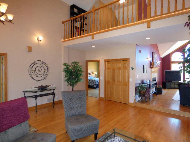 41W951 Hunters Hill Dr, Saint Charles, IL 60175 - living area featuring a high ceiling and wood finished floors
