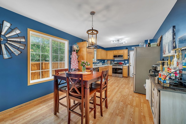 1308 Cumberland Dr, Joliet, IL 60431 - dining space featuring light wood-style floors and a chandelier