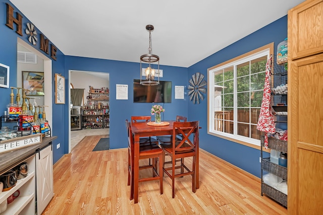 1308 Cumberland Dr, Joliet, IL 60431 - dining room featuring light wood-type flooring and a chandelier