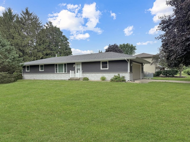 701 E Soper St, Winnebago, IL 61088 - ranch-style house with a garage, a front yard, and concrete driveway