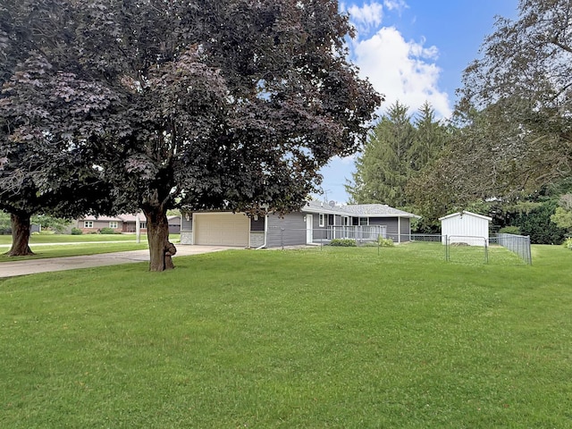 701 E Soper St, Winnebago, IL 61088 - view of front of home with concrete driveway and a garage