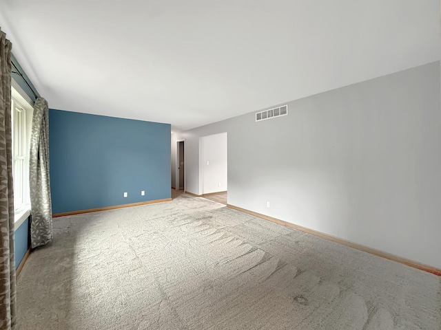 701 E Soper St, Winnebago, IL 61088 - empty room featuring light colored carpet and baseboards